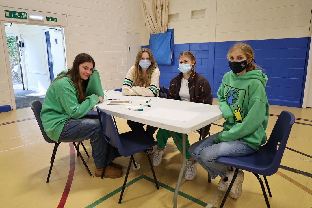 Picture of students dressed in green 