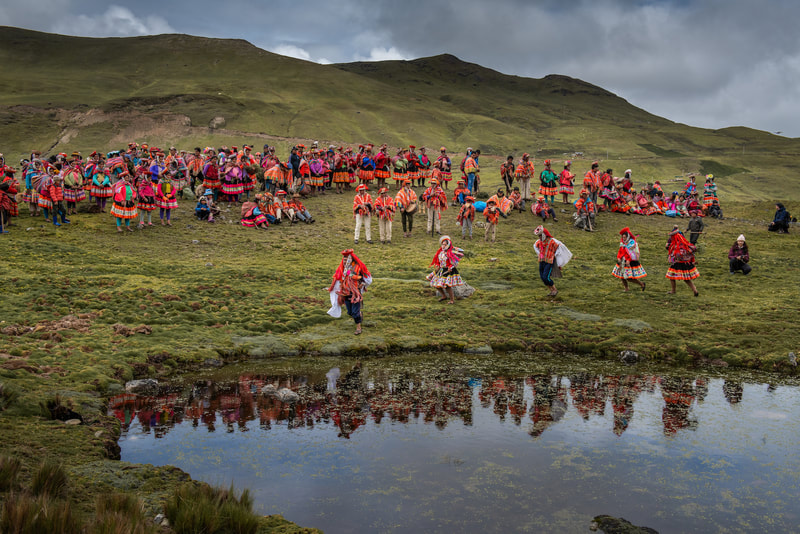 The Queuña Raymi - tree planting festival - members of the local community dance around the lake.