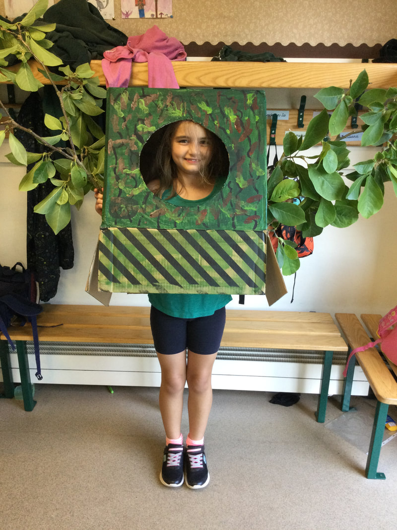 Picture of a young girl dressed as a tree