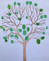 Picture of a bare tree with green thumb prints all over it's branches to represent leaves