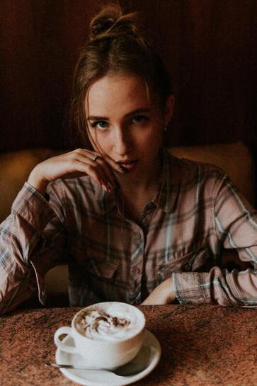 Picture of a young woman drinking coffee