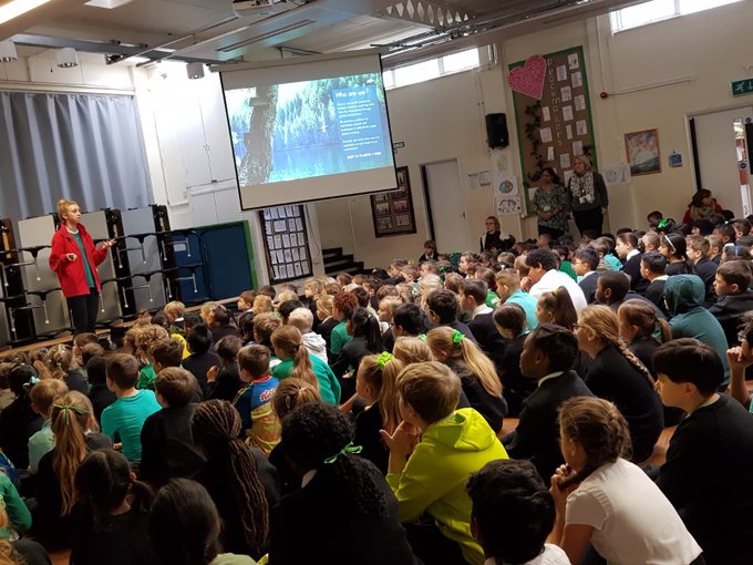 Picture of children listening to a JUST ONE Tree assembly