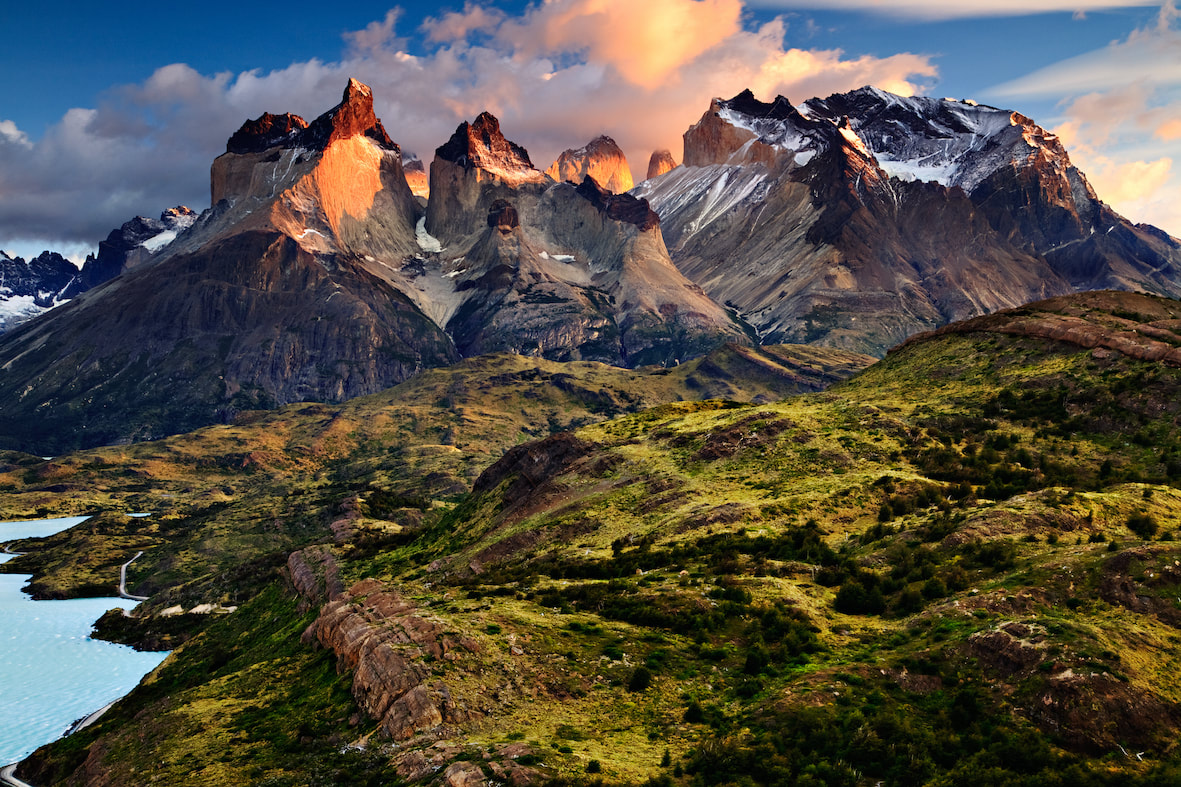 Picture of the a beautiful snow capped mountain and green landscape in the Andes